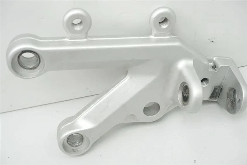 APRILIA RSV 1000 RR ZD4RR FUßRASTENPLATTE FAHRER LINKS HALTER FUßRASTE